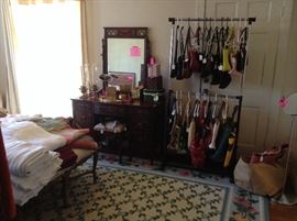 Lots of linens, purses galore and some are name brands, large rug