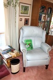 Leather wingback recliner chair and small gilt table