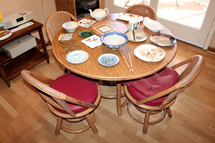 Round rattan table & 4 swivel chairs