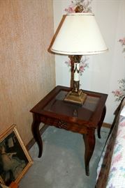 Glass-top end table and brass lamp