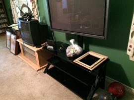 analog television (SOLD), and television tables, one with big screen mounting bracket, big screen television needs bulb, speakers (SOLD)