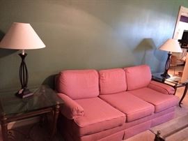 Rosy pink fabric sofa, two lamps, two lamp tables with matching coffee table.