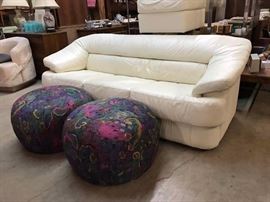 Small leather sofa with matching ottoman