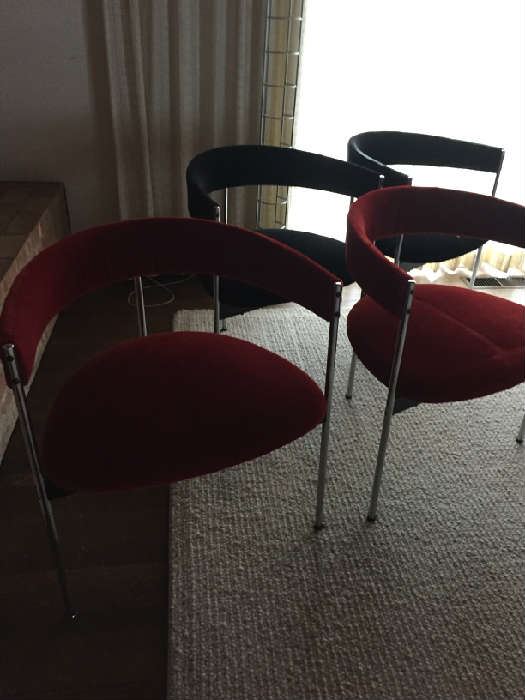 8 Chrome and Velvet Dining Chairs 2 black and 6 red Half moon shaped with 3 hairpin legs. 