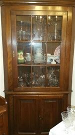 Crystal and China in a Solid Maple Corner Cabinet