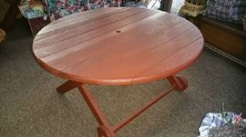 Vintage Redwood Patio Table (matching rectangle and server tables not shown but available - indoor kept).  New umbrella and stand not shown.  Folding vinyl patio chairs also available.