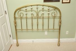 Full size brass headboard.