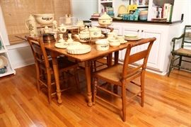 Cherry dropleaf table and four vintage chairs.