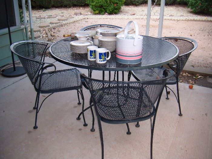 Mid Century Iron patio table and 4 chairs.