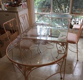 Pink Wrought Iron and Glass Table with 2 rounded extensions and 6 chairs