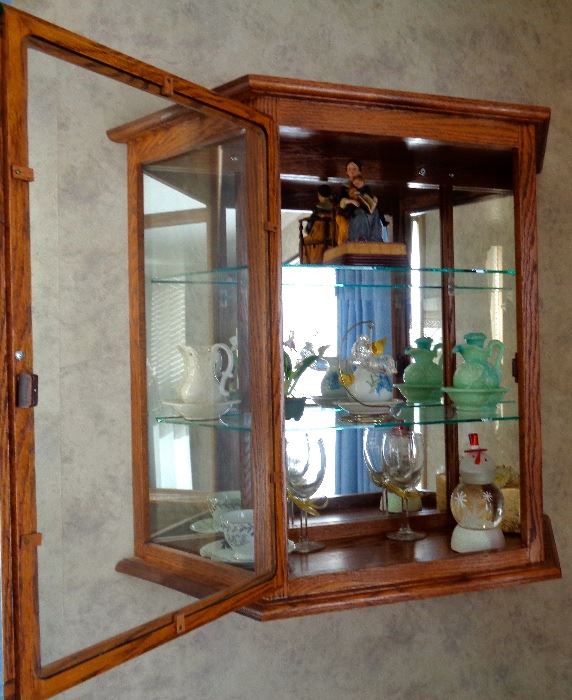 (2) Solid Oak Wall Mounted Curio Cabinet. There are 2 Cabinets For Sale. Precious Moment Figure Collection, Avon Jadite Pitcher