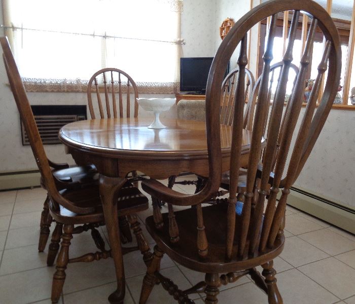 Antique Dining Room Set. Solid Wood Oval Table with one extra Leaf, 5 Tall Chairs 1- Tall Captain Chair for a Total of 6 Chairs.