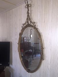 Very ornate vintage mirror, has some minor damage 
