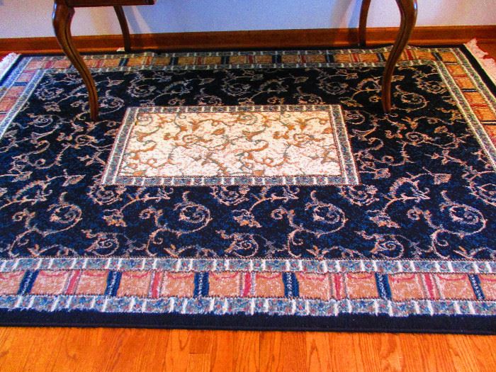 1 of 2 matching dark blue area rugs 93"L x 58"W