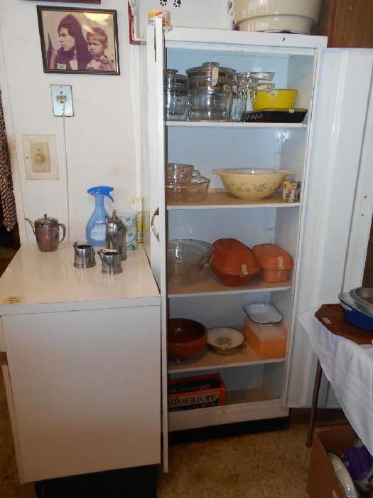 small cabinet, Pyrex dishes, German Roemertopf, etc.