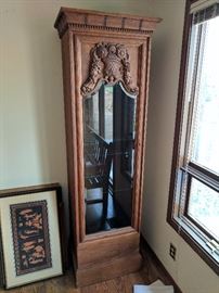 Display cabinet with deep carving