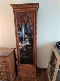 Display cabinet with deep carving
