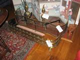 Two Fireplace Fenders, one antique with solid brass and one Virginia Metal Crafters with combination solid brass and cast iron.  Also a pair of Antiques Brass Andirons.