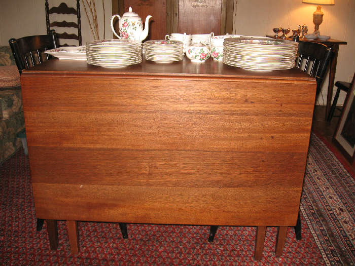 A handmade drop leaf table