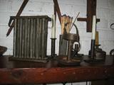 Many primitives in the family room. Here an 18th century candle mold tin.