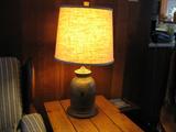 Many old primitive crock lamps