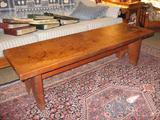 A handmade long pine bench