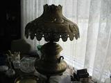 A very nice Collectibel Brass Oil Lamp that has been converted to Electricial. This is a very Unusual Lamp is one of a kind!!