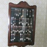 Collectible Spoons and a Wall Cabinet