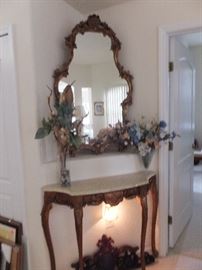 Italian Provincial marble top entry table with gilt on legs and gilt mirror