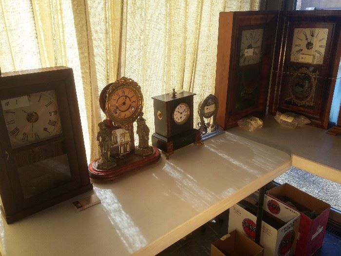 Large collection of mantel clocks, grandfather clocks, wall clocks