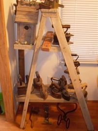 LADDER WITH SAD IRONS