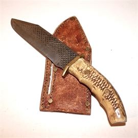 Custom Bone Handle 7" File Blade Vintage Bowie Knife with Leather Sheath: A custom bone handle 7" file blade vintage bowie knife with leather sheath. Knife features a carved grip handle with scored cross-hatch pattern and two brass rivets, a brass cross guard, and a clipped point blade with file surface treatments to both side of the blade at different scales. The stitched custom leather sheath has seven strengthening brass rivets.