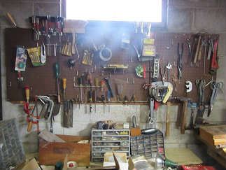 The tools include saws, screw driver sets, plyers, multi drawers filled with screws and other.  There is also outdoor tools. 