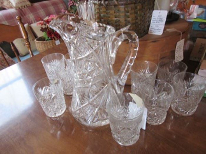 Cut glass pitcher with 10 glasses. 