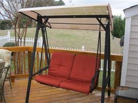 Outdoor covered swing