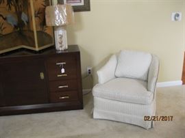 One of pair mid century wood trimmed occasional chairs