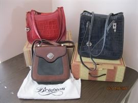 3 Brighton Bags, One that is shown on the white Brighton dust cover appears new and never used. The other two were lightly used and come with their original boxes. These will be with the Cashier and must be paid for before removing from cashier table.