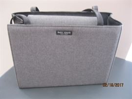 Kate Spade bag, appears to have been rarely or never used. Will be with cashier for viewing and must be paid before removal from table.
