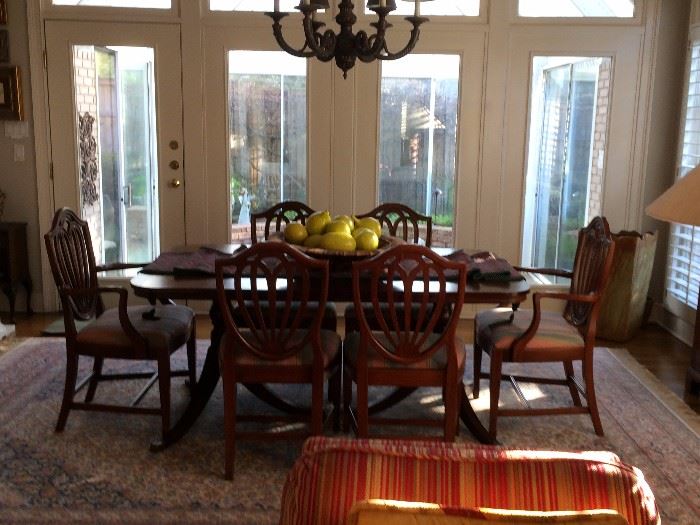 Mahogany dining room table has 3 leaves and is 42 inches wide (with no leaves the leight is 66 inches long ) and 8 shield back chairs , china cabient and buffet   area rug 
