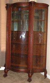 Jordan Marsh & Co. House Furnishing Annex Boston (C1905-1910) Antique Golden Tiger Oak Serpentine Glass Front China 5-Shelf Cabinet raised on Claw Feet & Original Casters (64"H x 43"W x 18"D)