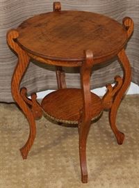 Antique Tiger Oak Round Plant Stand with Scroll Serpentine Legs and Brass Decor Tack Trim .                        (16"D x 18"H)