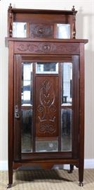 English Antique Oak Music Cabinet with Incised Carved Center Panel with Bevel Mirror Panels Door and Raised Back Splash with Shelf. Original Casters (0verall 49"H x 21 1/4"W x 14"D)