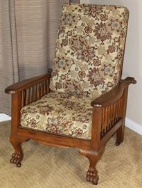 Antique Quarter Sawn Oak Morris Chair, Brass Rod Adjustable 4-Position Back.  Claw Foot Front Legs all with Original Casters, Upholstered in a Earth Tone Floral Tapestry.