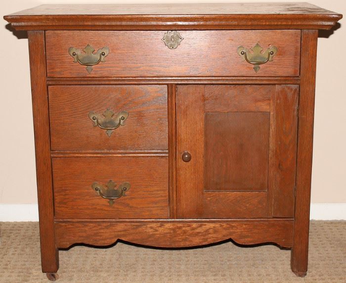 Antique Quarter Sawn Oak Bow Fron Top Wash Stand. Original Hardware and Casters ((34"W x 29.5"H x 20.5"D)