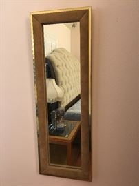 retro mirror framed in faux suede and brass -very cool piece