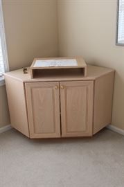 this sweet corner table/cabinet has a swivel base to accomodate tv viewing in bed.