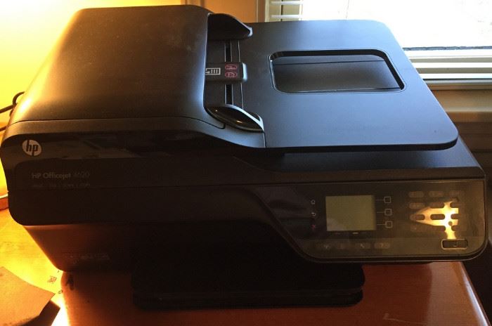 HP OfficeJet 4610 with booklet and spare ink cartridges