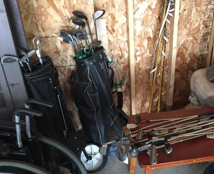 Plenty of golf clubs and a couple bags