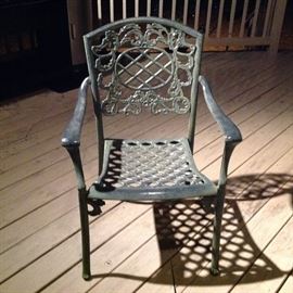 Four  wrought iron patio chairs