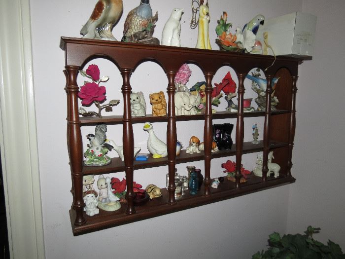 Curio Shelf Full Of Collectible Figurines